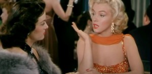 Undeva, cândva... / Marilyn Monroe, în anul 1954, alături de cadilacul său negru